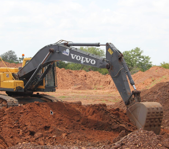 An excavator at work on an equipment hire project site